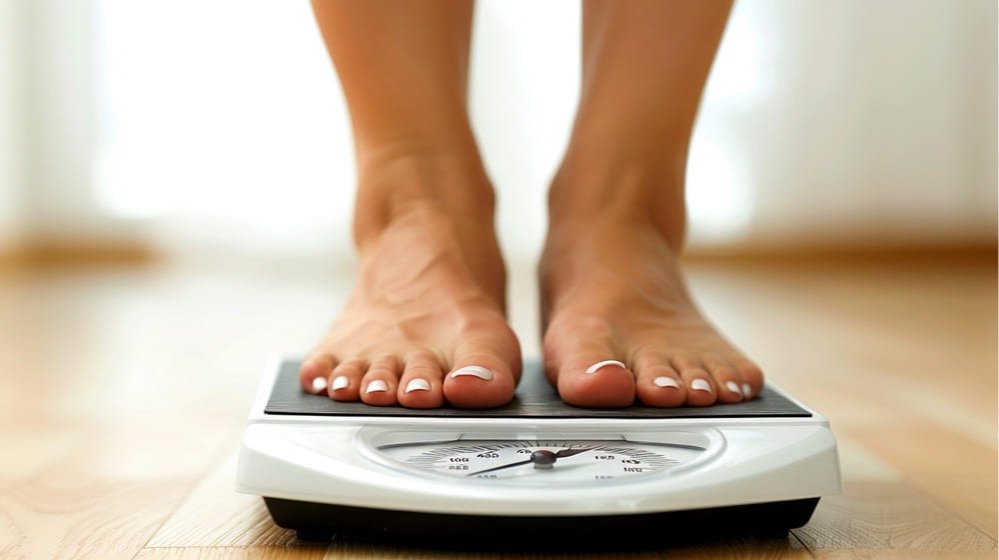 woman-standing-scale-with-number-10-her-feet (1)